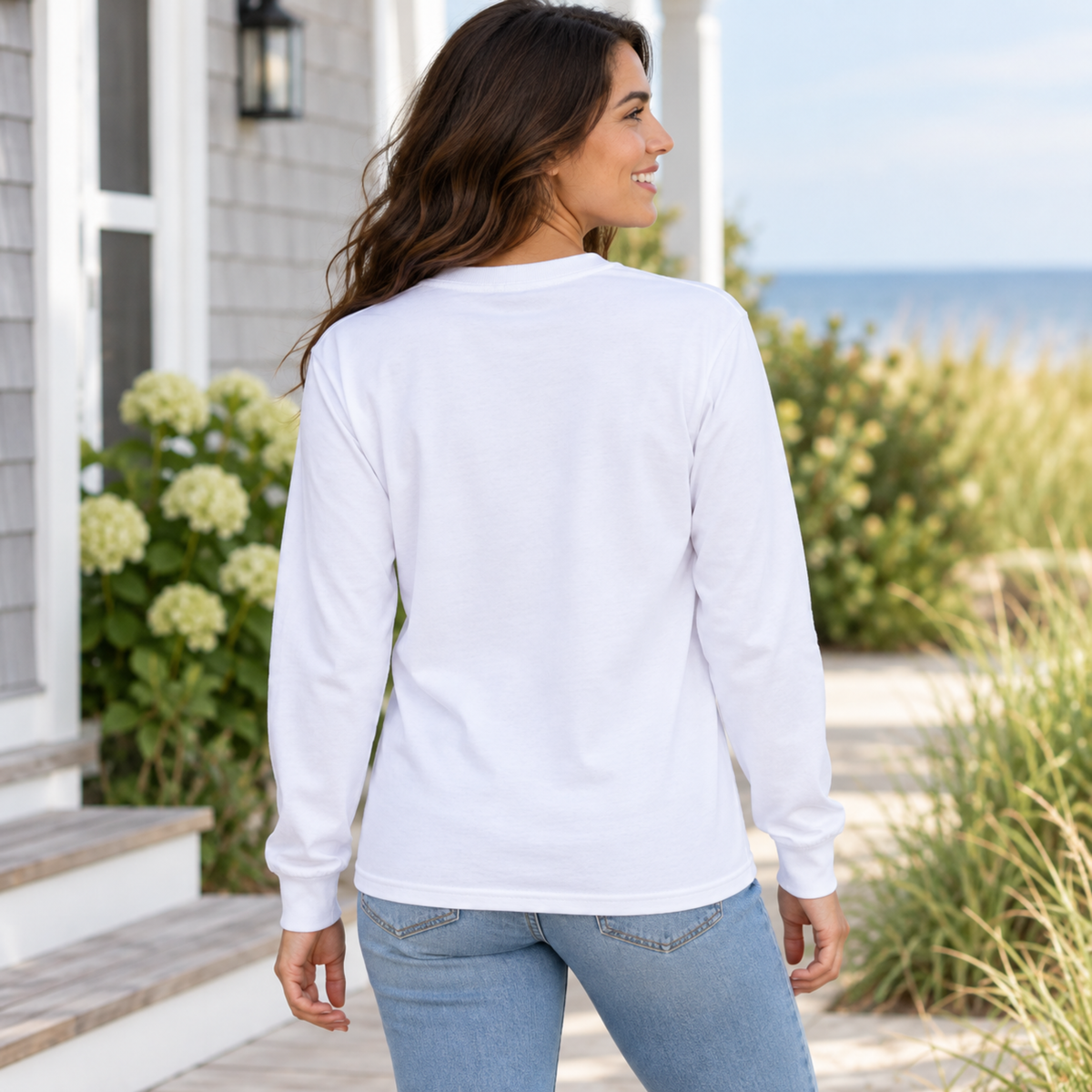 Women’s white Port & Co PC55LS long sleeve shirt back fit view