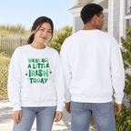 Woman showing the green Irish Today graphic while a man shows the plain back of the white sweatshirt