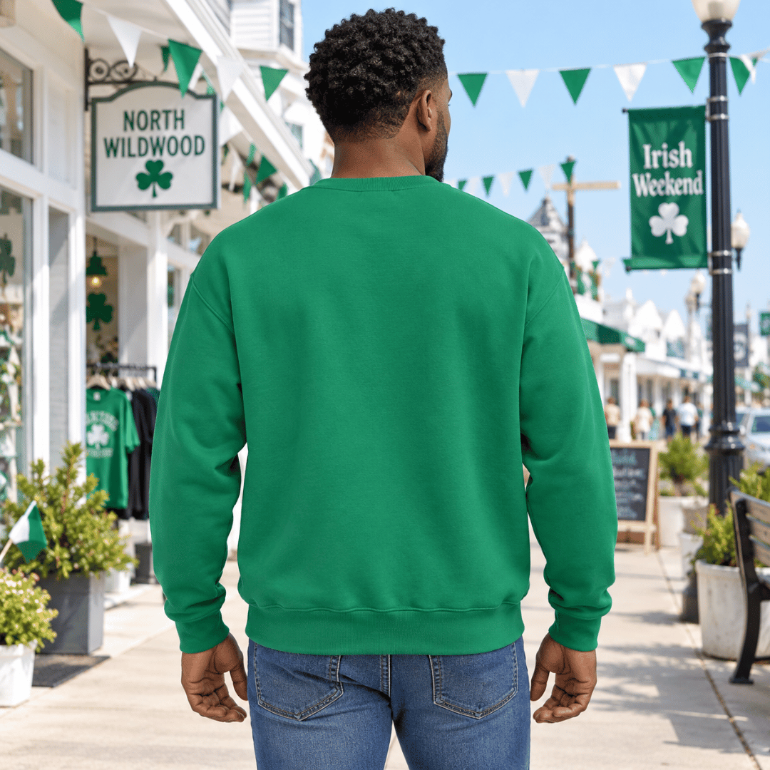 Back view of a man wearing a plain Kelly Green crewneck sweatshirt outdoors