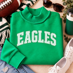 Women’s Kelly green Philly mock neck sweatshirt with white EAGLES polka dot design styled with football game day accessories