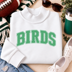 Women’s white Philly mock neck sweatshirt with green BIRDS polka dot design styled with football game day accessories