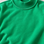 Close-up of Kelly green women’s mock neck sweatshirt showing soft fabric texture, ribbed neckline and exposed seam detail