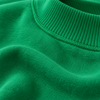 Close-up of Kelly green LA Society mock neck sweatshirt fabric, ribbed neckline and exposed seam