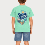 Back view of a boy in an Island Reef green Shore Vibes t-shirt showing the full New Jersey coastal graphic, studio photo