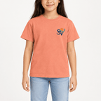 Girl wearing a Melon orange Shore Vibes t-shirt with the front logo, studio photo