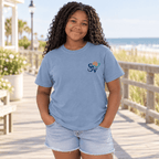 Back view of a girl in a Washed Denim blue Shore Vibes t-shirt showing the full New Jersey coastal graphic, studio photo