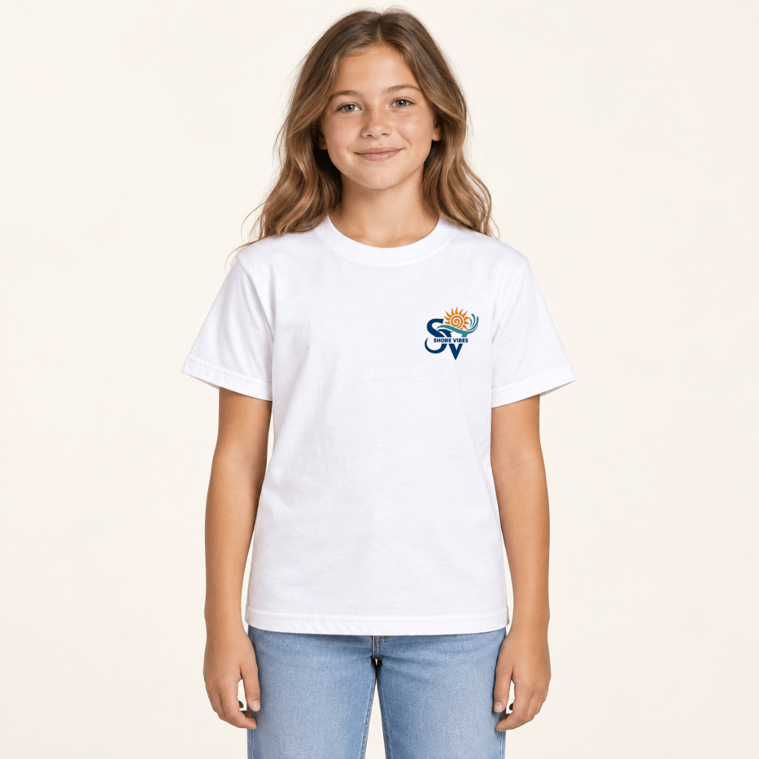 Girl wearing a white Shore Vibes t-shirt with the front logo, studio photo