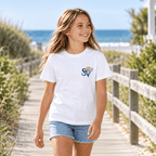 Girl wearing a white Shore Vibes t-shirt with the front logo, walking a boardwalk path near dune grass