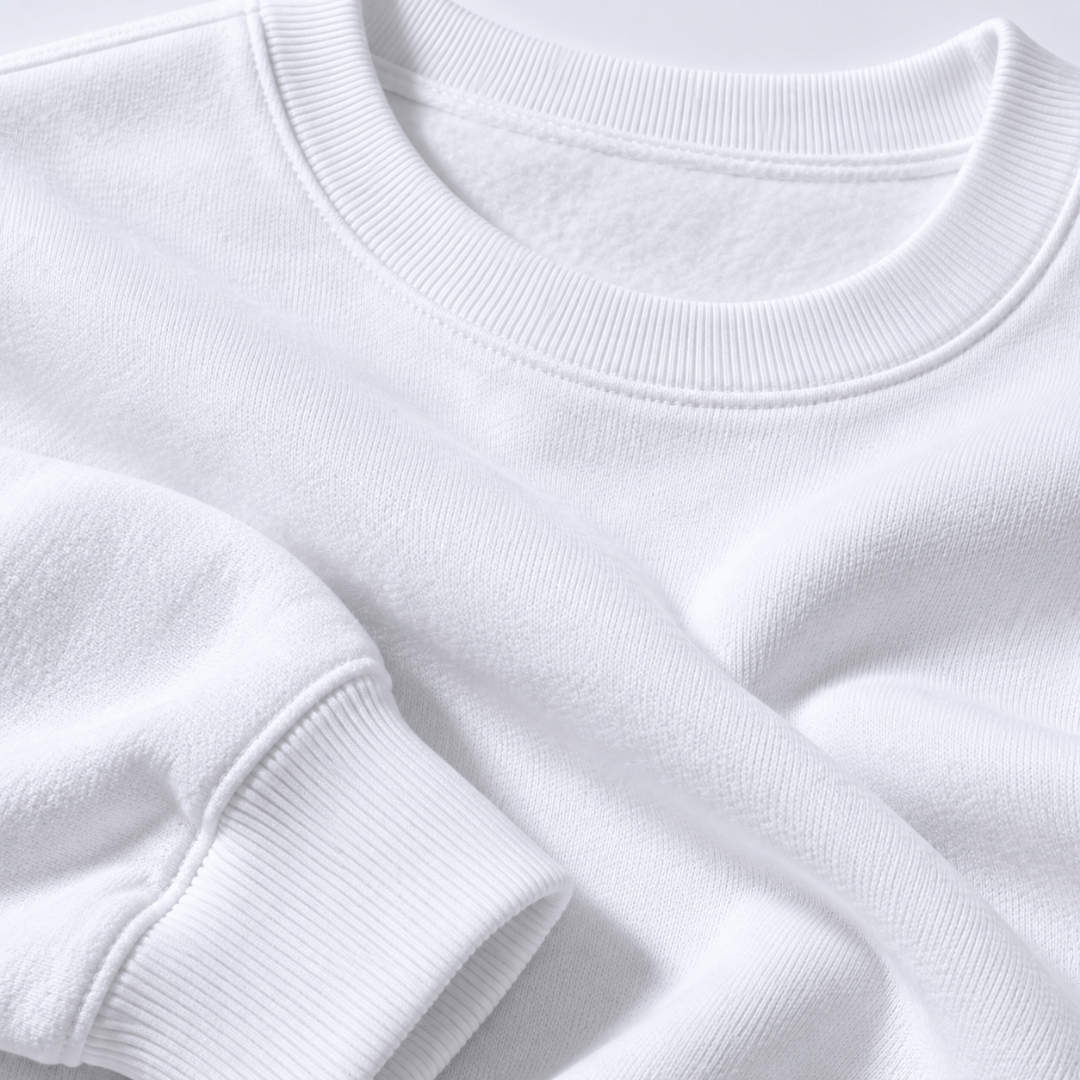 Close-up of the white sweatshirt fabric, ribbed crew neckline and cuff