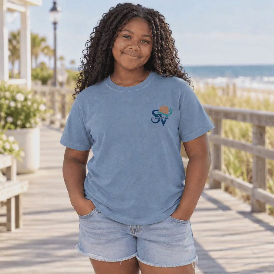 Front and Back view of a girl in a Washed Denim blue Shore Vibes t-shirt showing the full New Jersey coastal graphic, studio photo